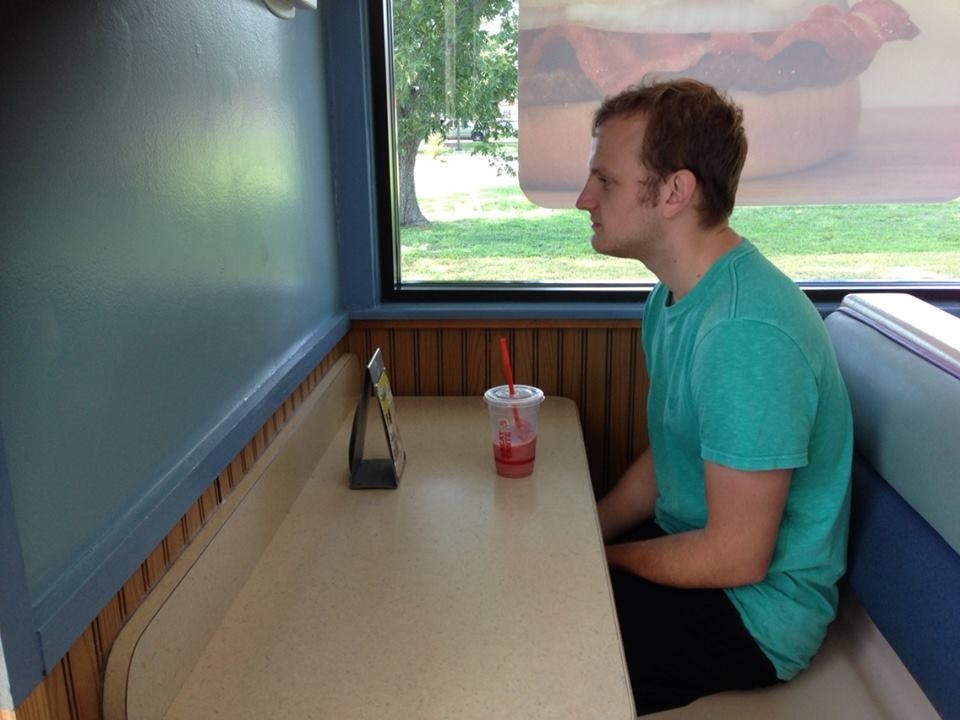 guy sitting alone at restaurant